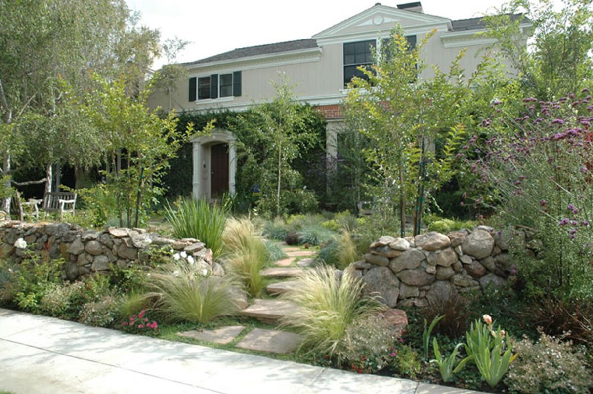 A house with a garden and stone walkway.